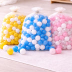 Bulk Baby Sensory Balls in white, blue, yellow, pink and rainbow colors. 