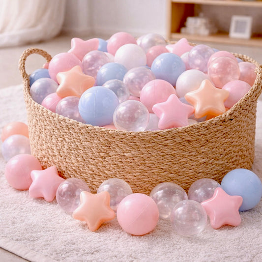 Pastel and neutral colored baby ball pit balls with pear and transparent stars.